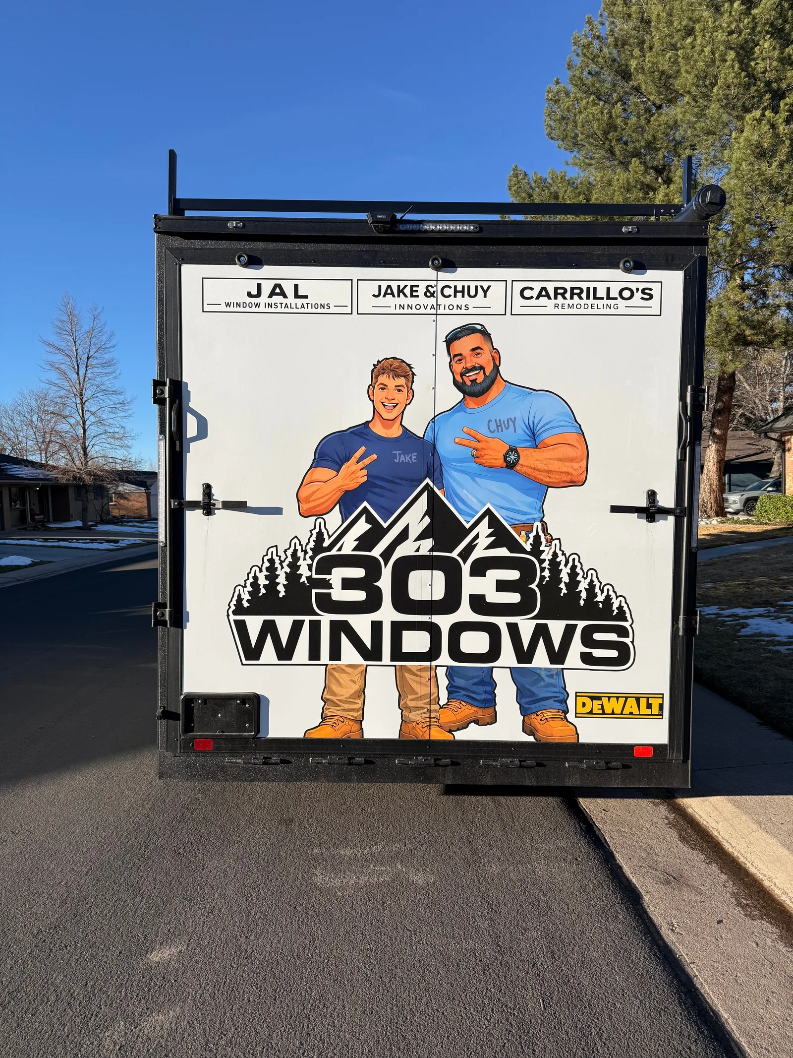 Large-scale 303 Windows trailer wrap featuring illustrated workers and a mountain logo